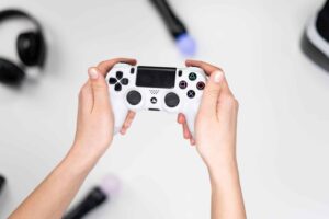 hands holding a gaming controller